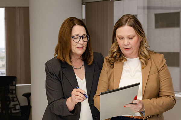 Two lawyers reviewing a document